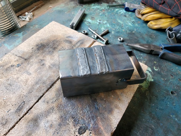 [Image showing the welding jig with weld beads built up]