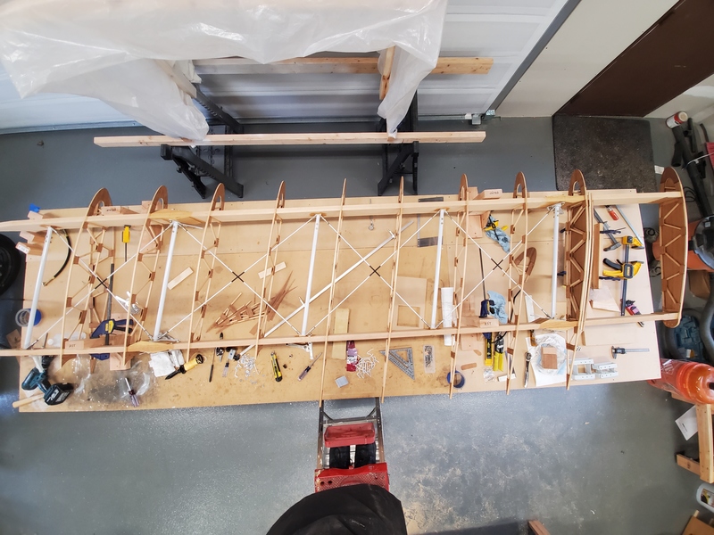 Photo of a partially assembled biplane wing sitting on a
workbench, shot from above