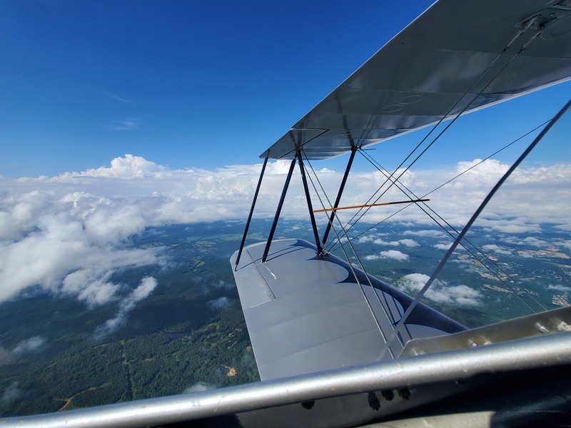 Photo of a big
stack of clouds off the left wing of the biplane
